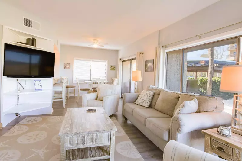 The living room also features a large screen TV.