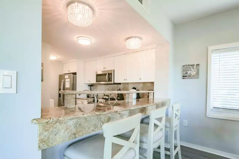 The kitchen looks out onto the dining area.