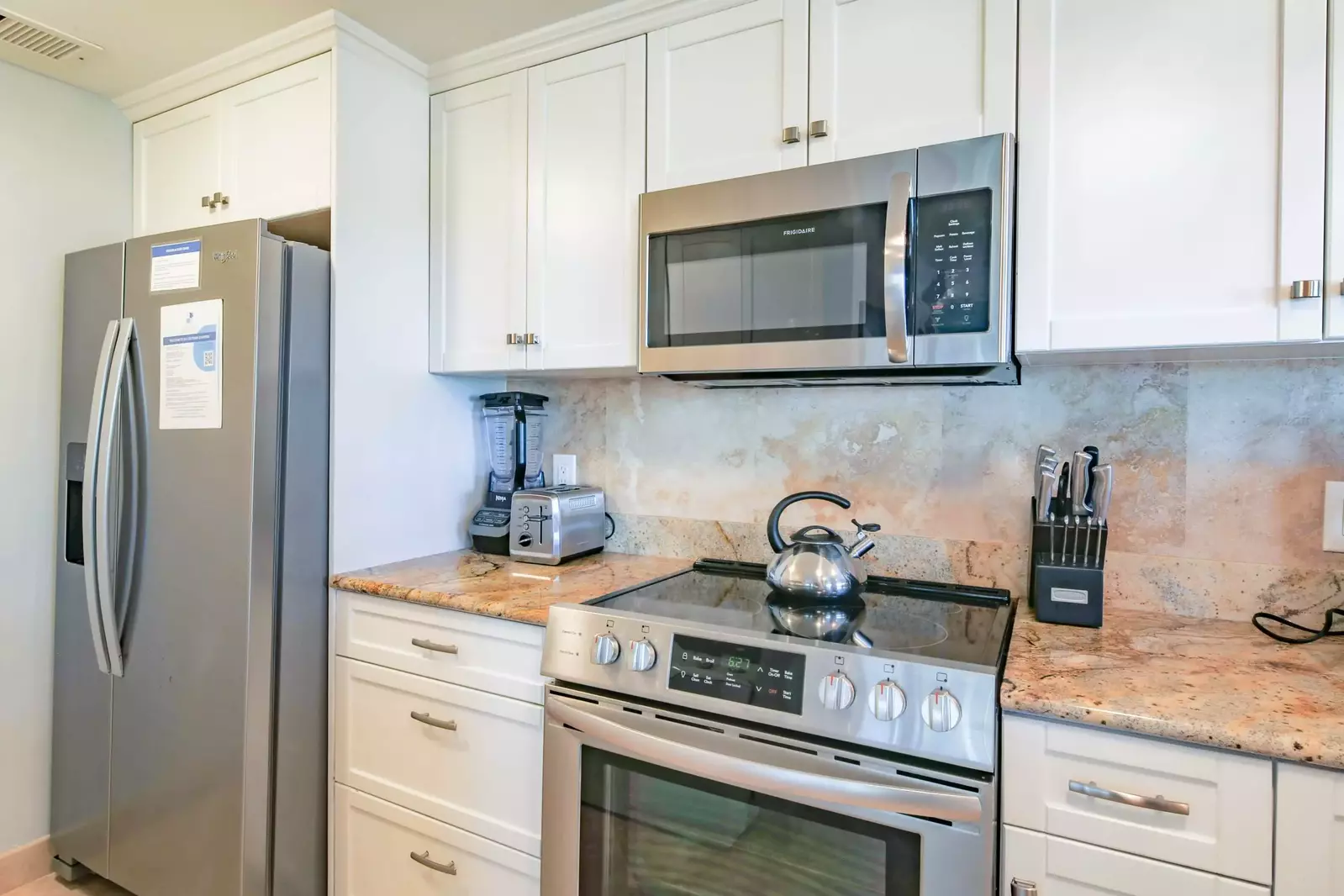 There is also a range, microwave, blender, toaster and refrigerator.