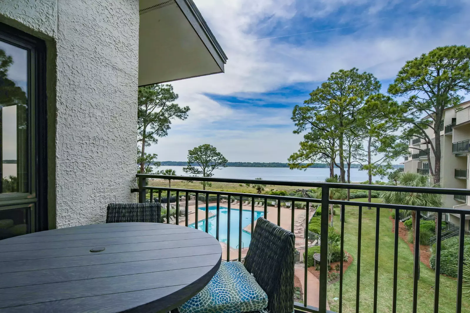 Dine al fresco at the outdoor table on the balcony off of the living room.
