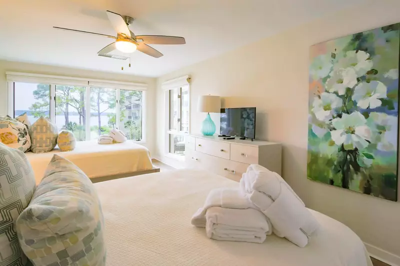 The guest suite also features a dresser, TV and ceiling fan.