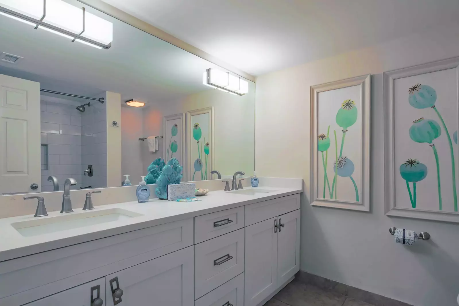 The en suite bathroom features a dual sink vanity.