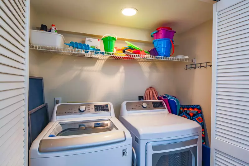 There is a full sized washing machine & dryer in the laundry closet.