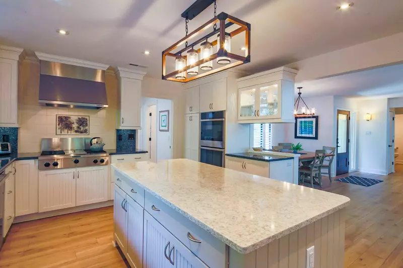 The living room and dining area flow into the gorgeous kitchen.