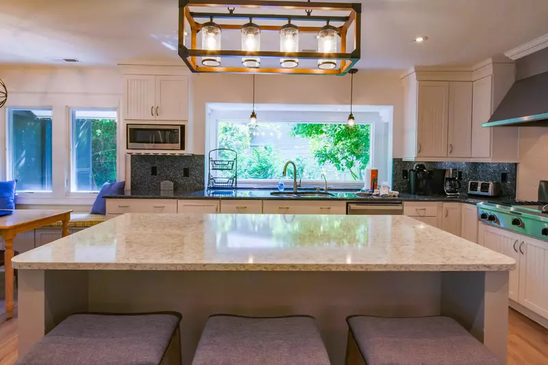 The kitchen receives terrific natural light through the large window above the sink.