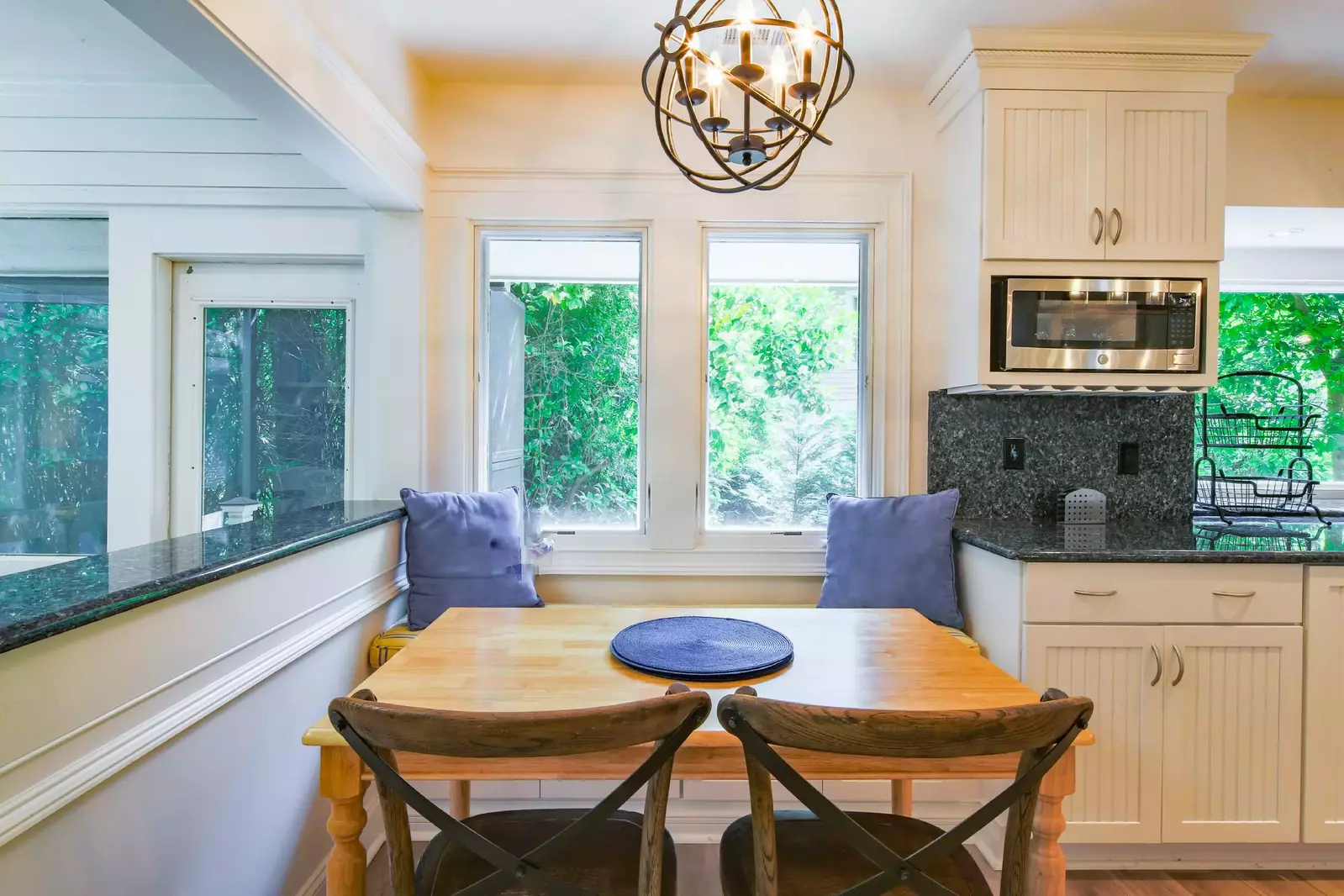 With a banquette in the kitchen and dining room table, you can have an adult table and a kids' table.