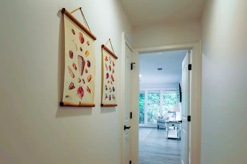 The master suite is just down this hallway from the living room.