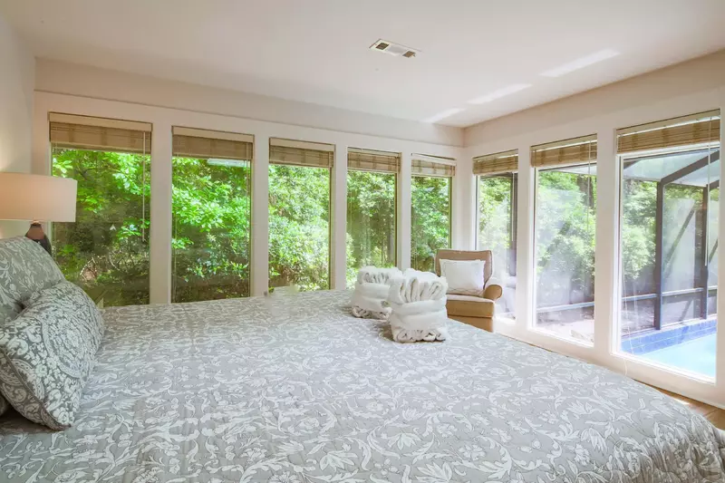 The master suite receives terrific natural light through its many windows.