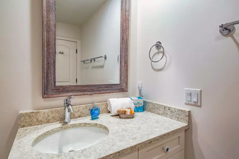 This en suite bathroom has a spacious vanity.