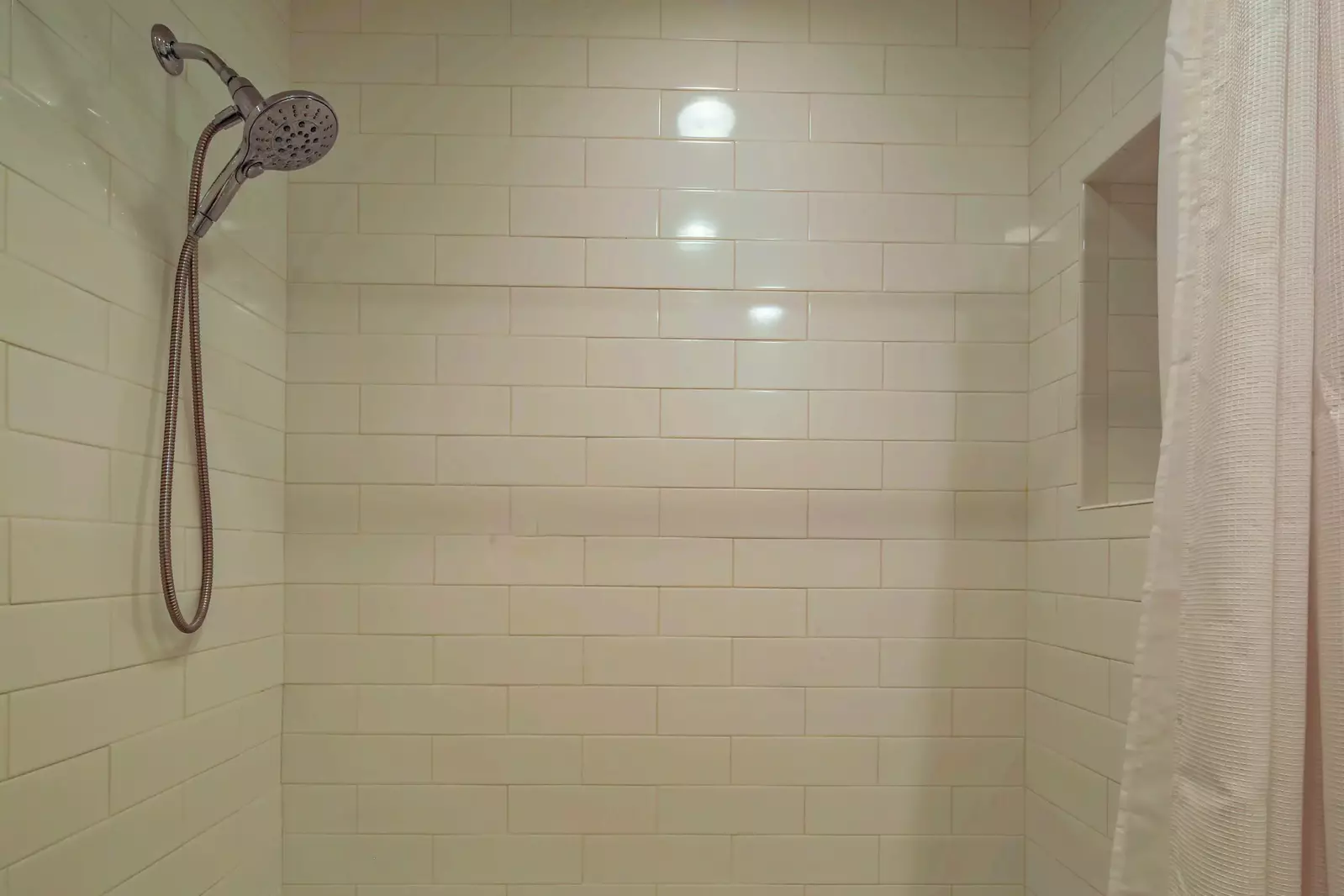 The hallway bath also has a tiled shower/tub combo.