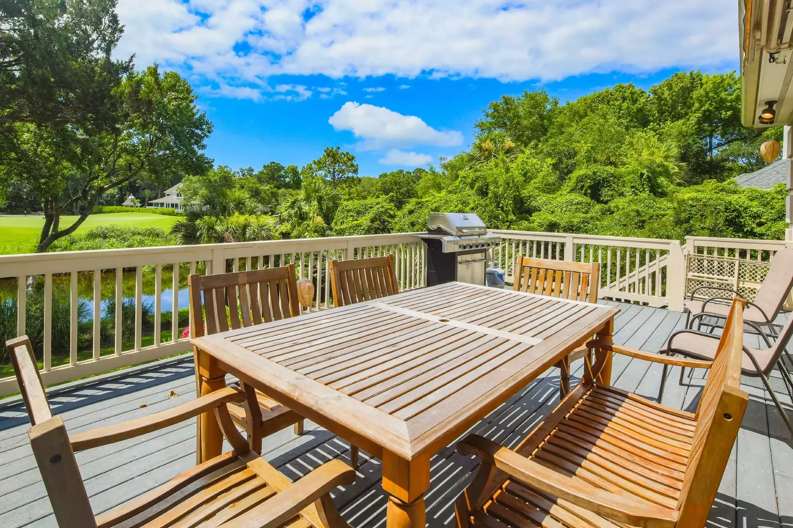 Dine al fresco on the back deck and enjoy views of the golf course & lagoon.