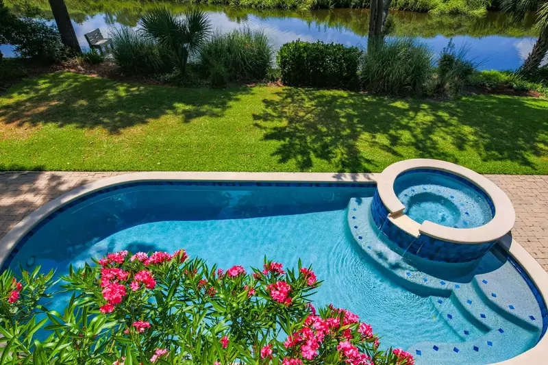 The private pool and spa are located in the backyard alongside the 11-mile lagoon.