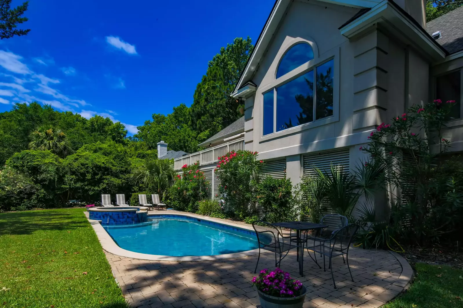 The home features a private pool, spa and spacious patio with lounge chair seating.