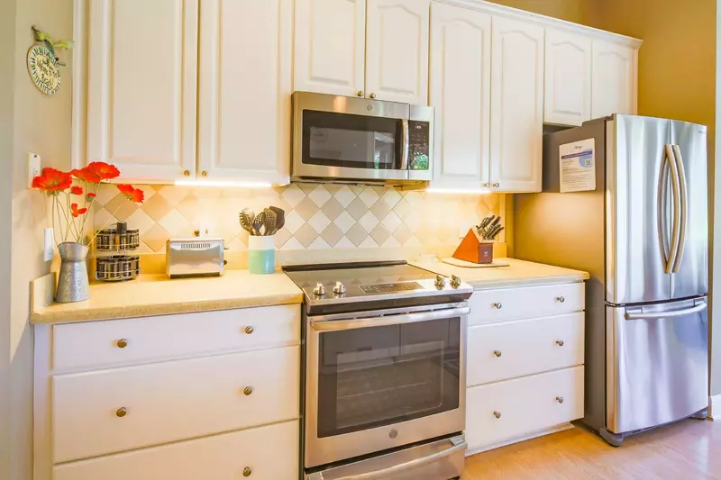 The kitchen also features stainless steel appliances.