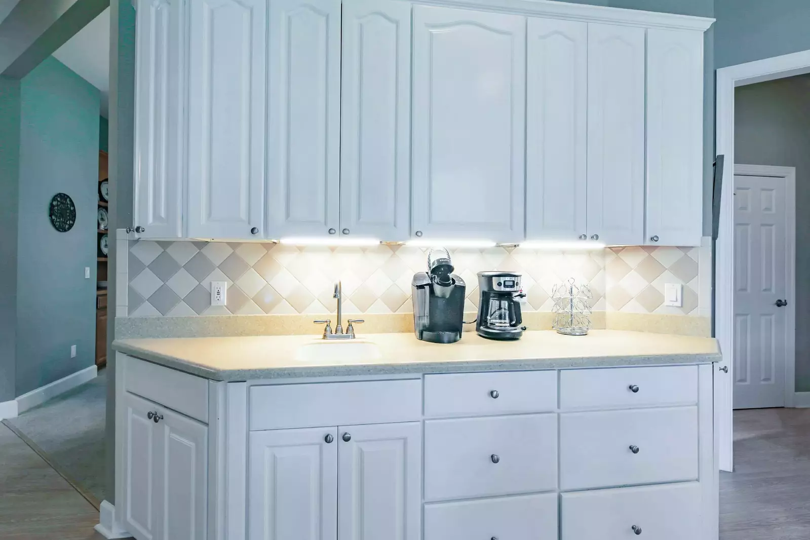There's a coffee bar and mini sink in the kitchen.