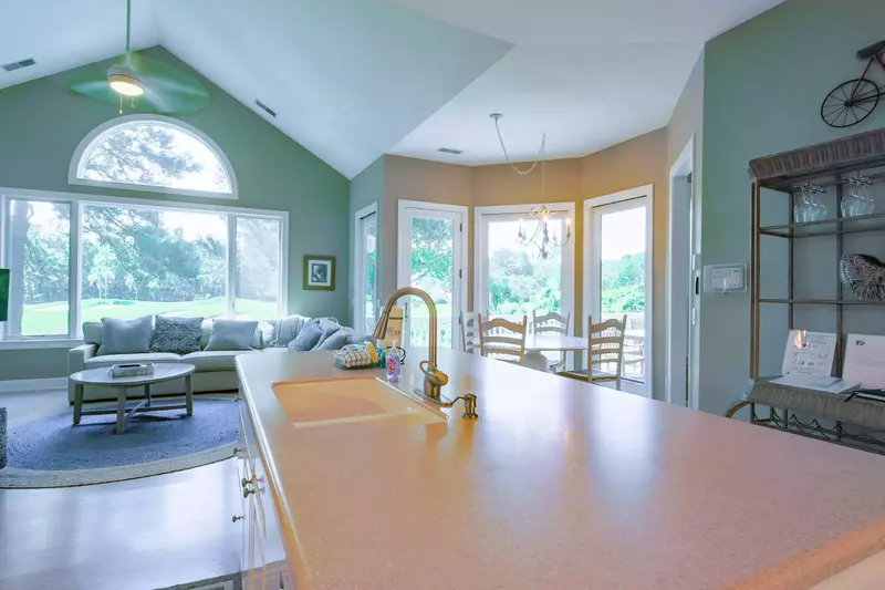 The open floor plan layout between the kitchen, family room and dining area make it easy to interact with your guests.