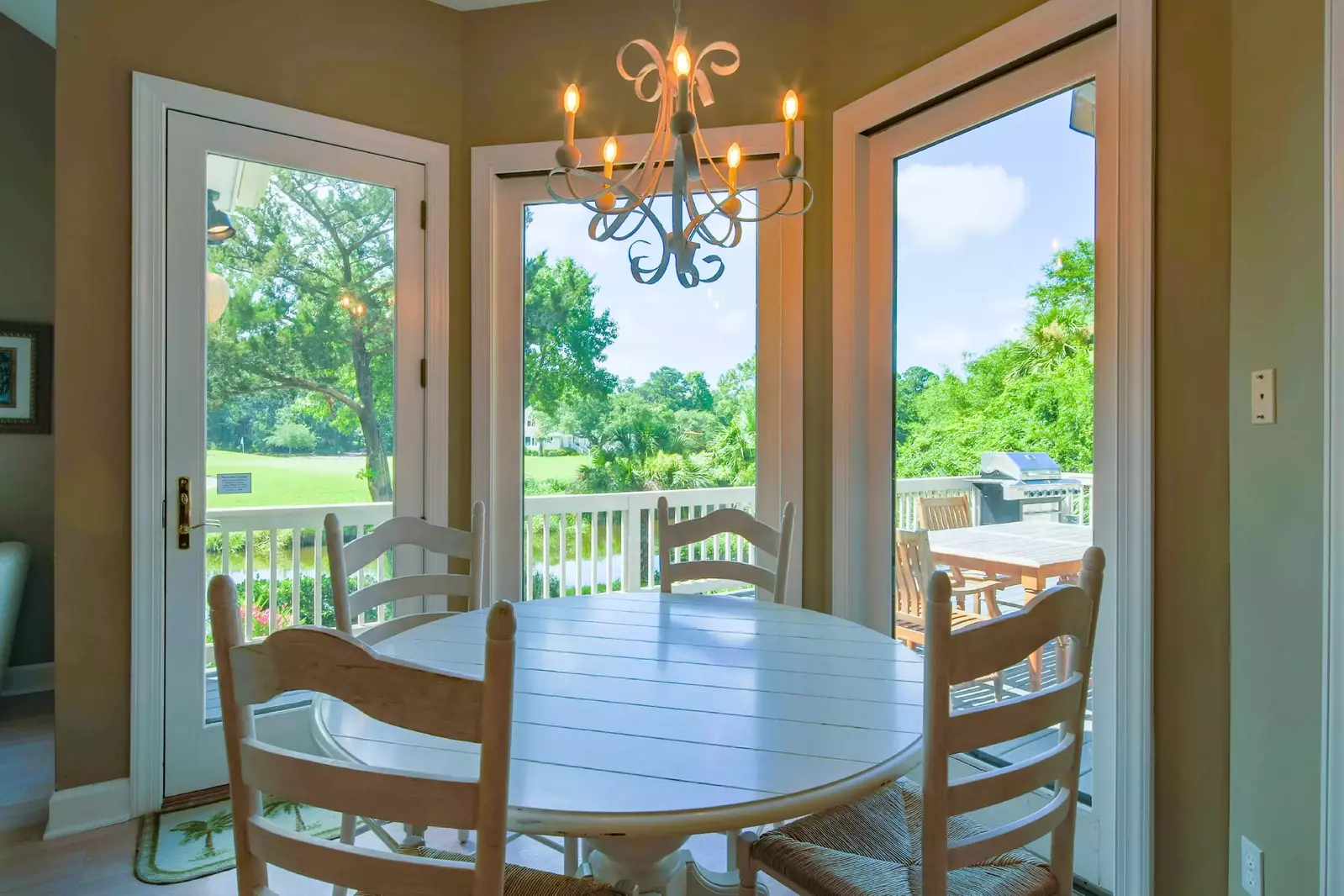 This table in the kitchen seats 4, the dining room seats 6 and the outdoor table seats 6.