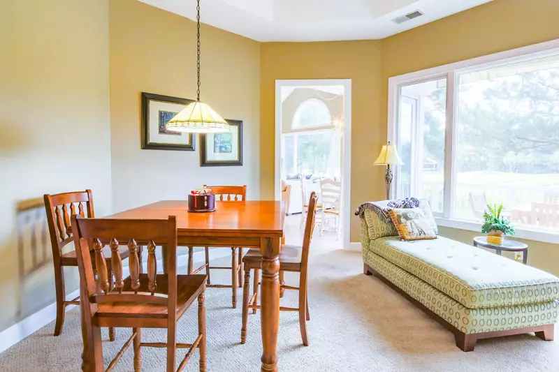 There's also a game table and chaise lounge in the living room.