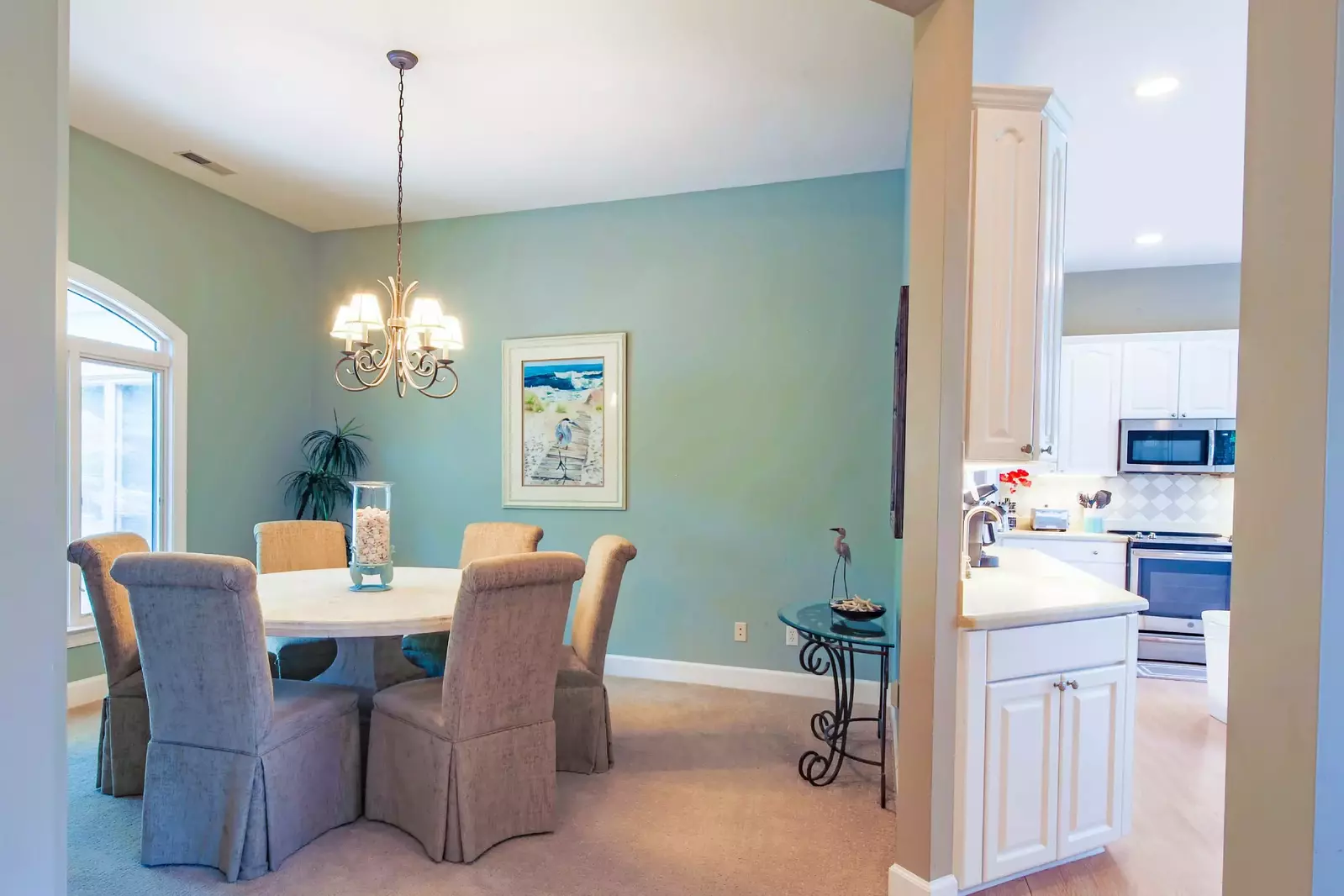 The formal dining area is located adjacent to the kitchen near the home's entryway.