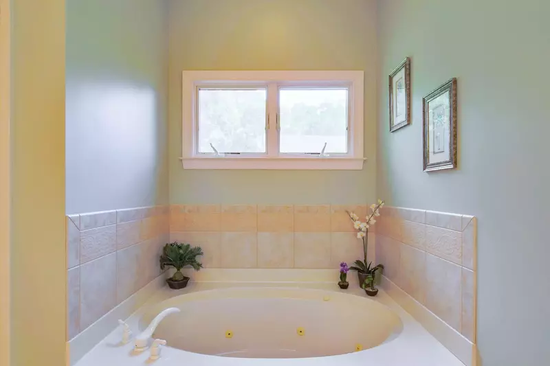 The en suite bathroom also has a soaking tub.