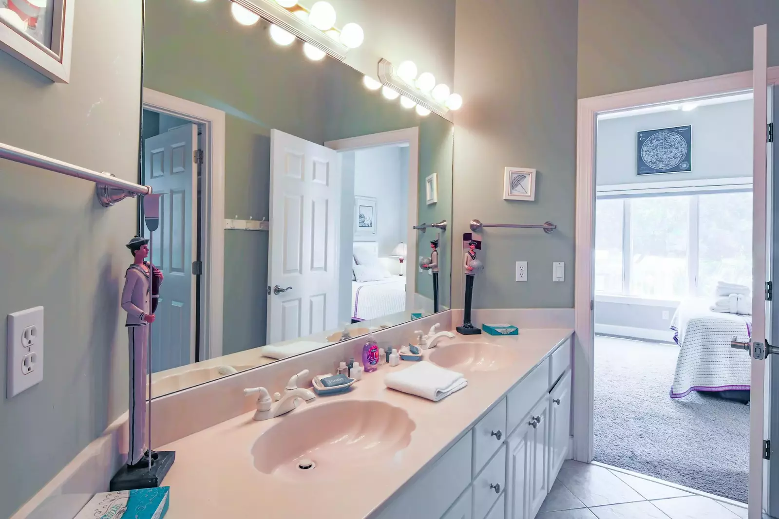 The jack & jill bathroom features a spacious, dual sink vanity.