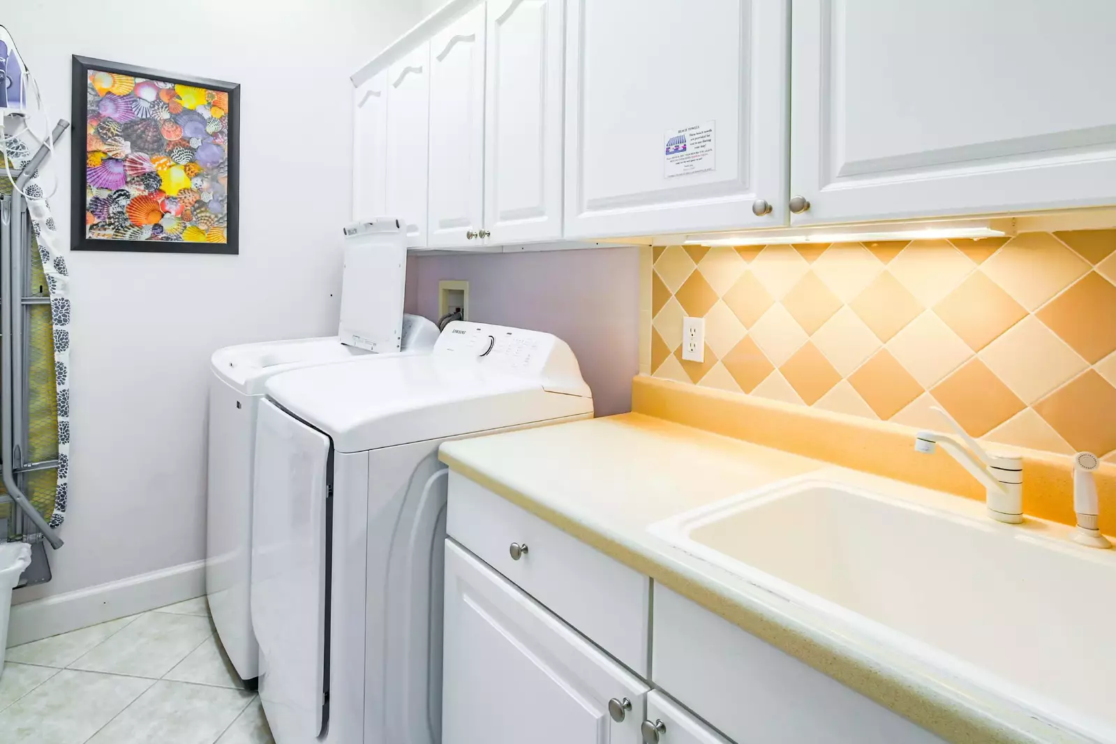 The home has a laundry room with a full sized washing machine and dryer and a utility sink.