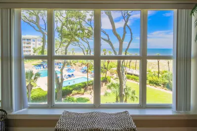 Enjoy views of the ocean & community pools from the living room, balcony and both suites.