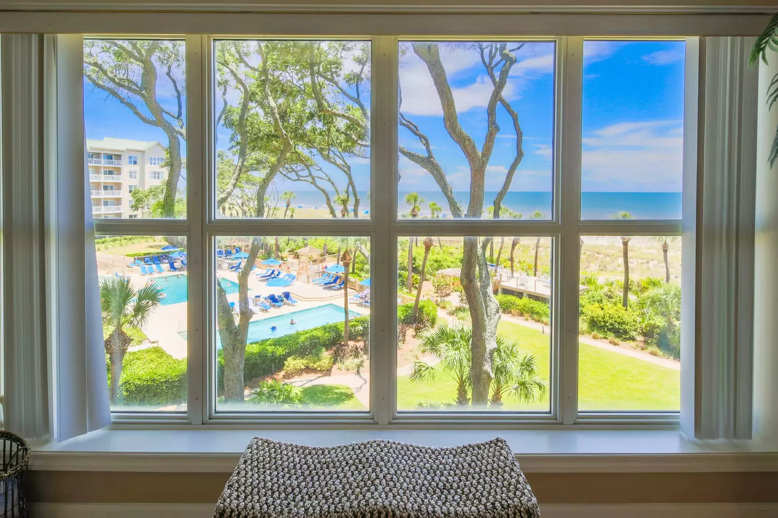 Enjoy views of the ocean & community pools from the living room, balcony and both suites.