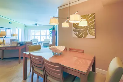 There is an open floor plan layout between the dining area and the living room.