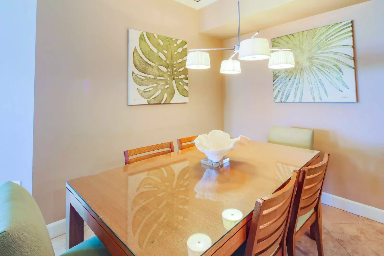 The dining table seats 6.  There is an additional outdoor dining table on the balcony.