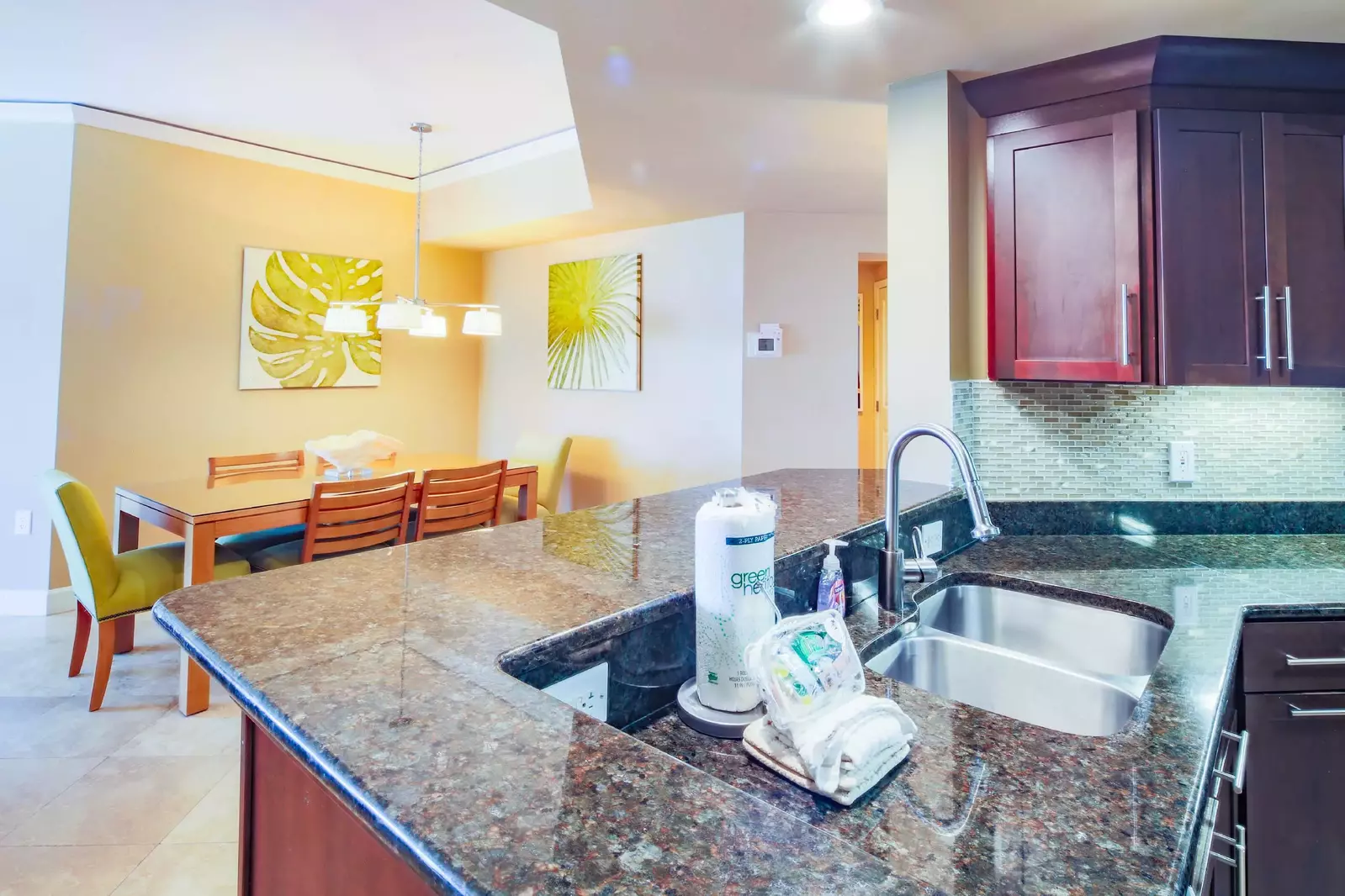 The open floor plan makes it easy to interact with your guests in the kitchen, dining area and living room.