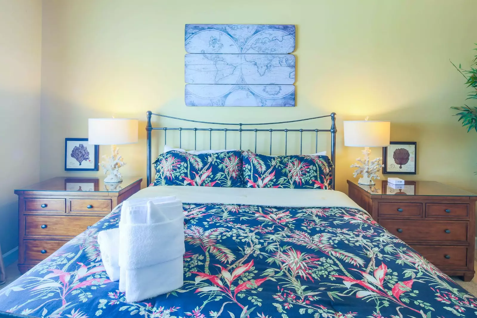 The master suite also features two nightstands with reading lamps.