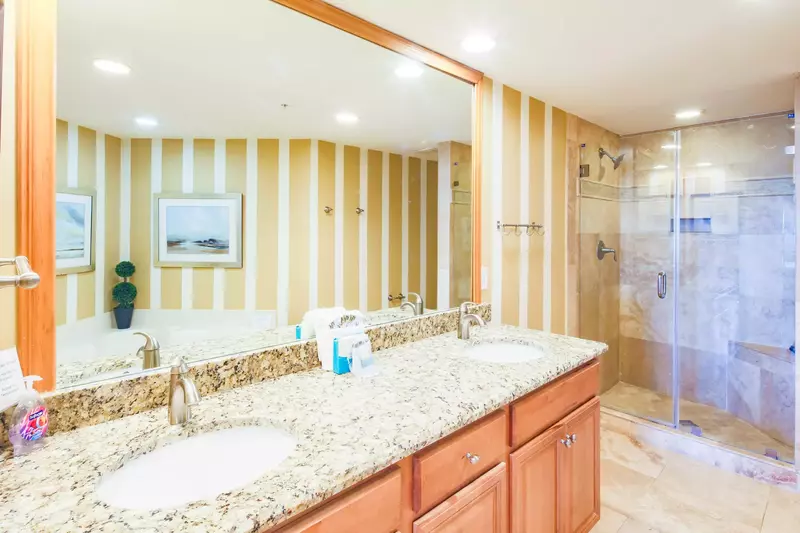The master en suite bathroom features a dual sink vanity, soaking tub and walk-in shower.