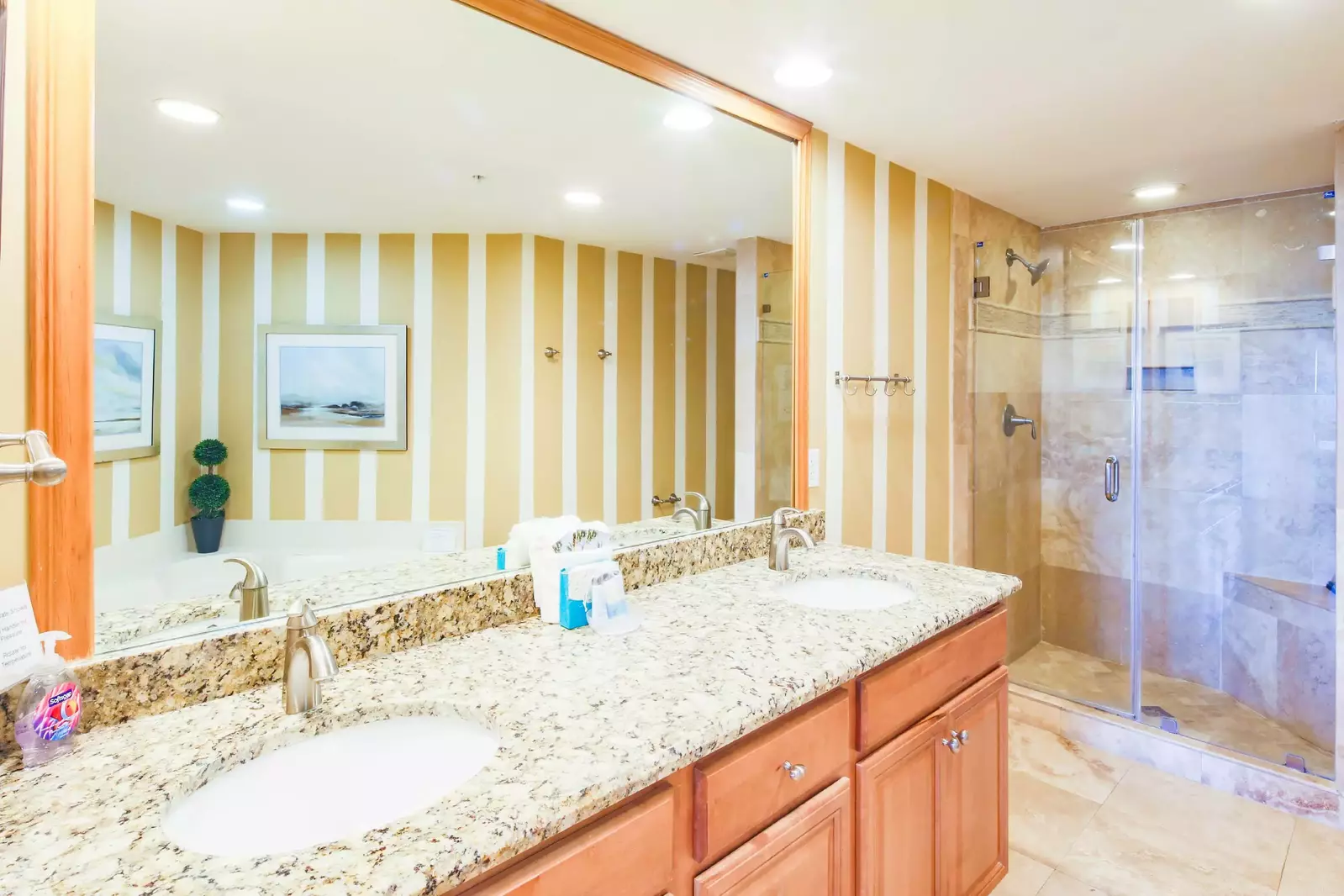 The master en suite bathroom features a dual sink vanity, soaking tub and walk-in shower.