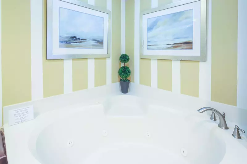 Soak away all your troubles in the corner tub in the en suite bathroom.
