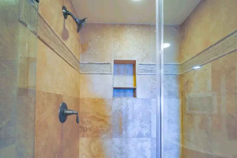 The master suite also features this tiled, walk-in shower.