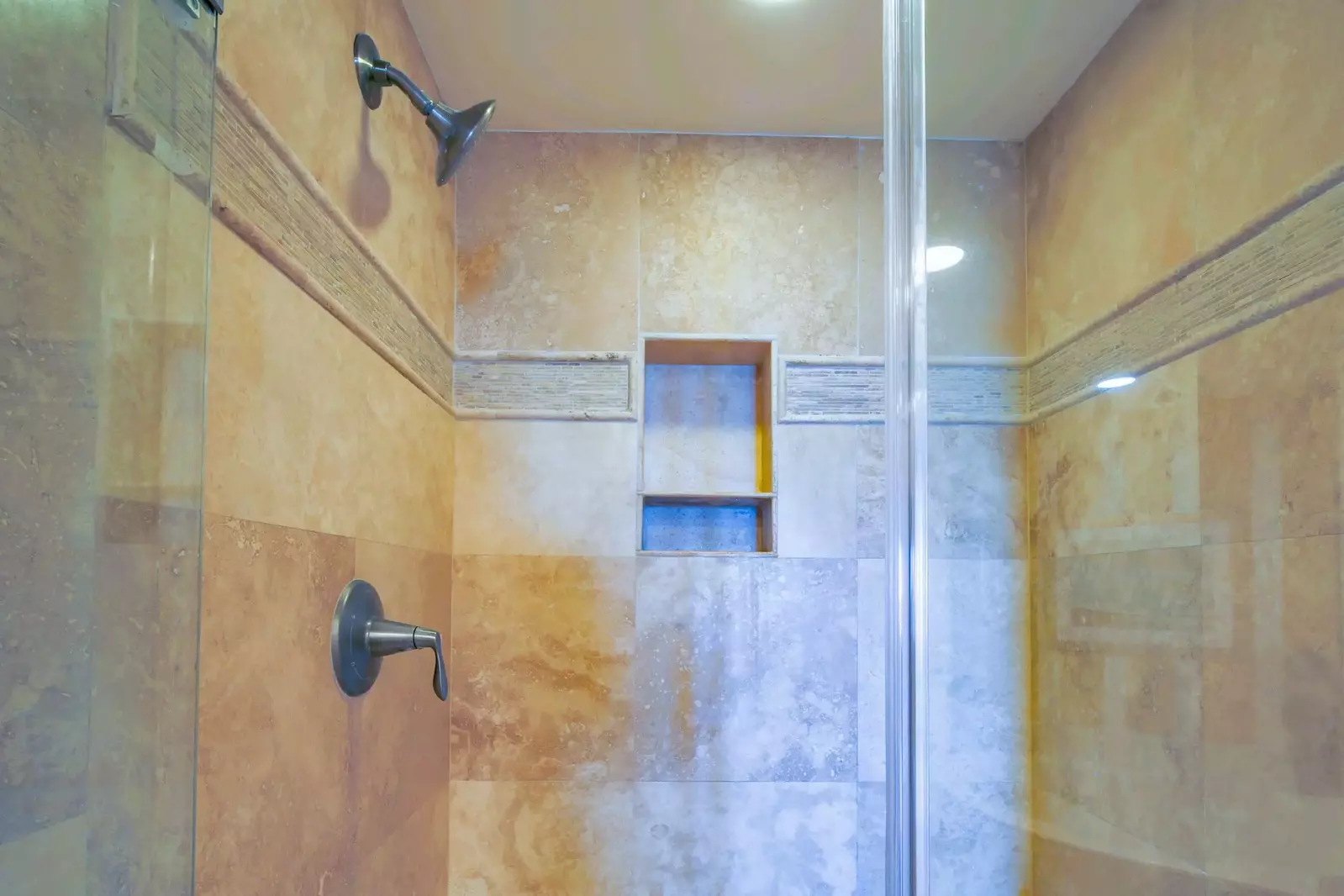 The master suite also features this tiled, walk-in shower.