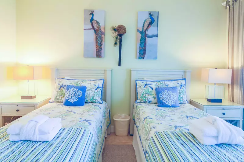 There are two nightstands with reading lamps in the guest suite.