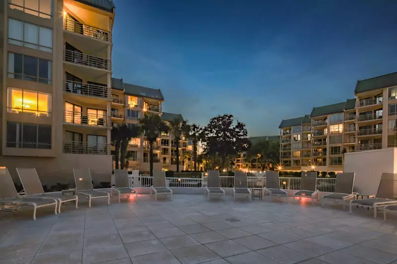 The Villarmare community has a spacious sundeck with lounge chairs.