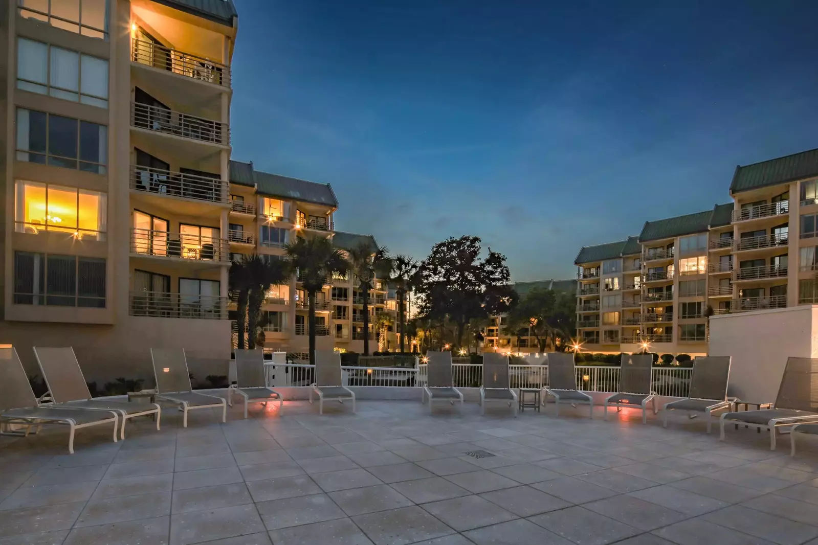 The Villarmare community has a spacious sundeck with lounge chairs.