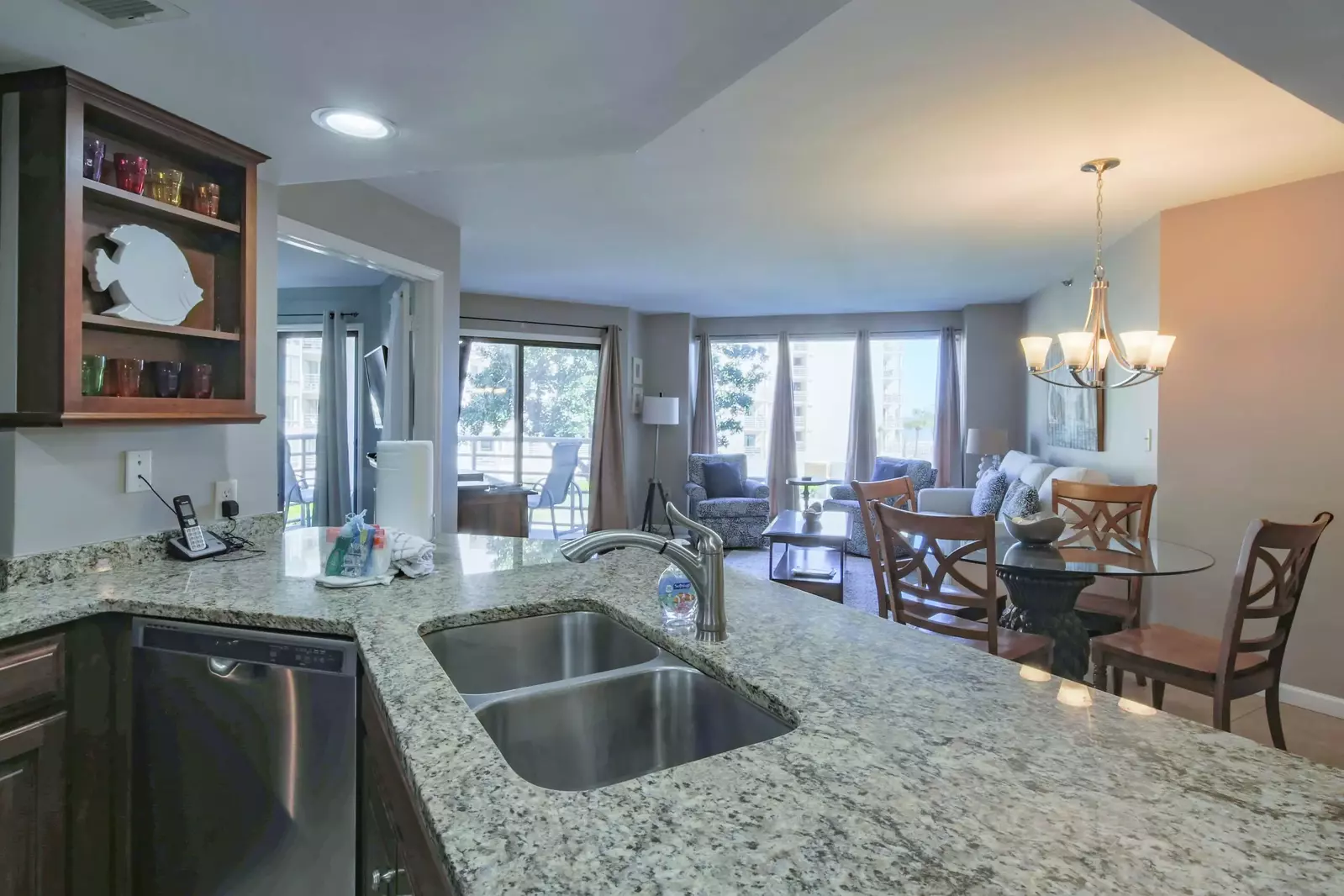 The kitchen opens into the dining area and living room.