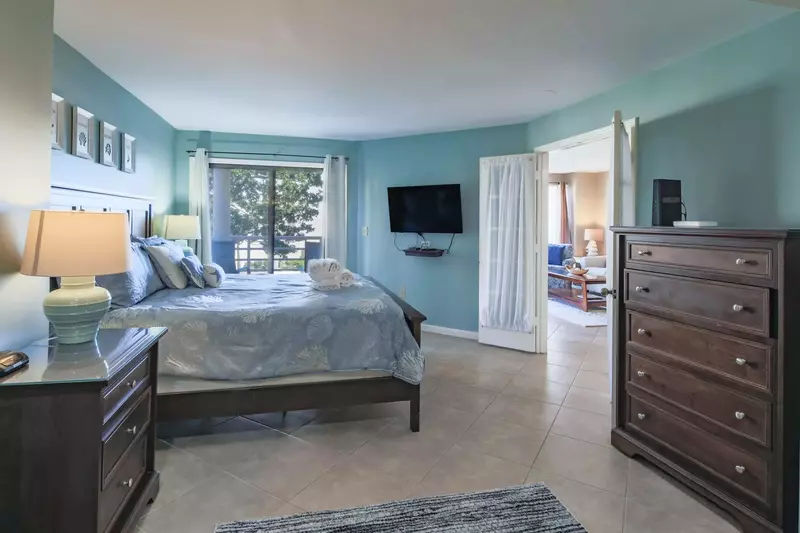 The master suite is located off of the living room and kitchen.