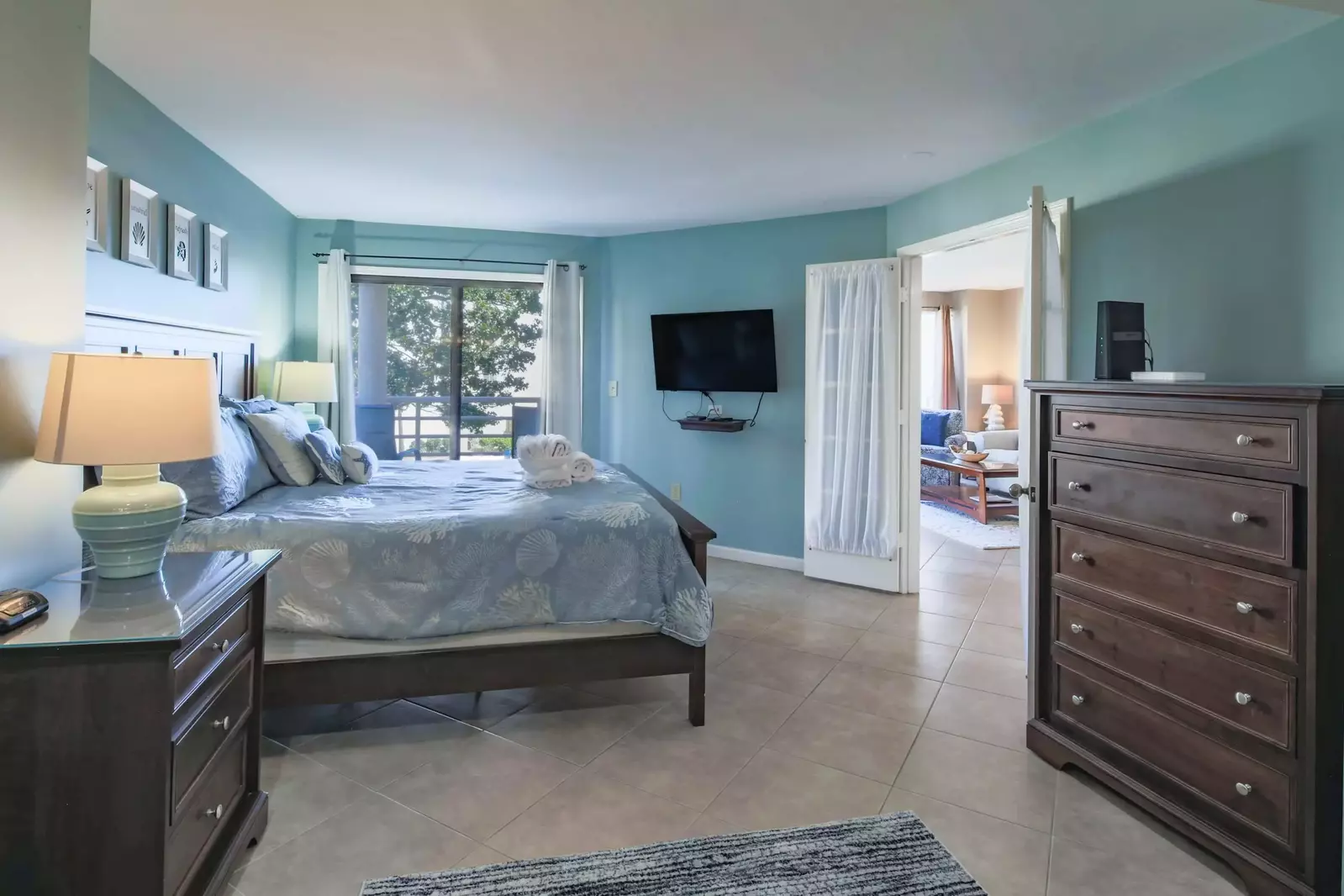 The master suite is located off of the living room and kitchen.