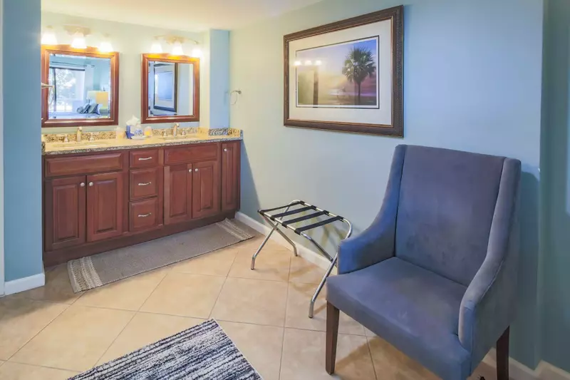 The master suite opens onto this double-sink vanity with granite countertops.