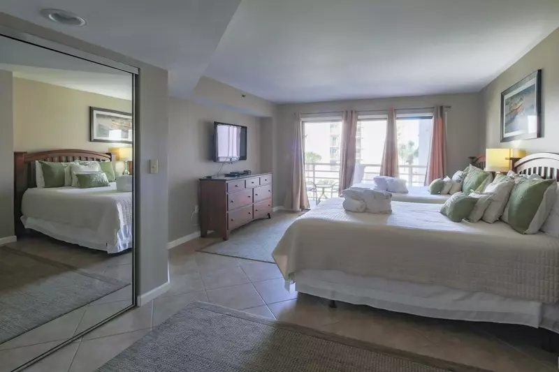 There is also a dresser and wall-mounted TV in the guest suite.