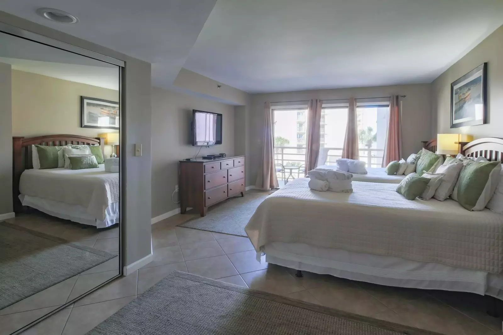 There is also a dresser and wall-mounted TV in the guest suite.