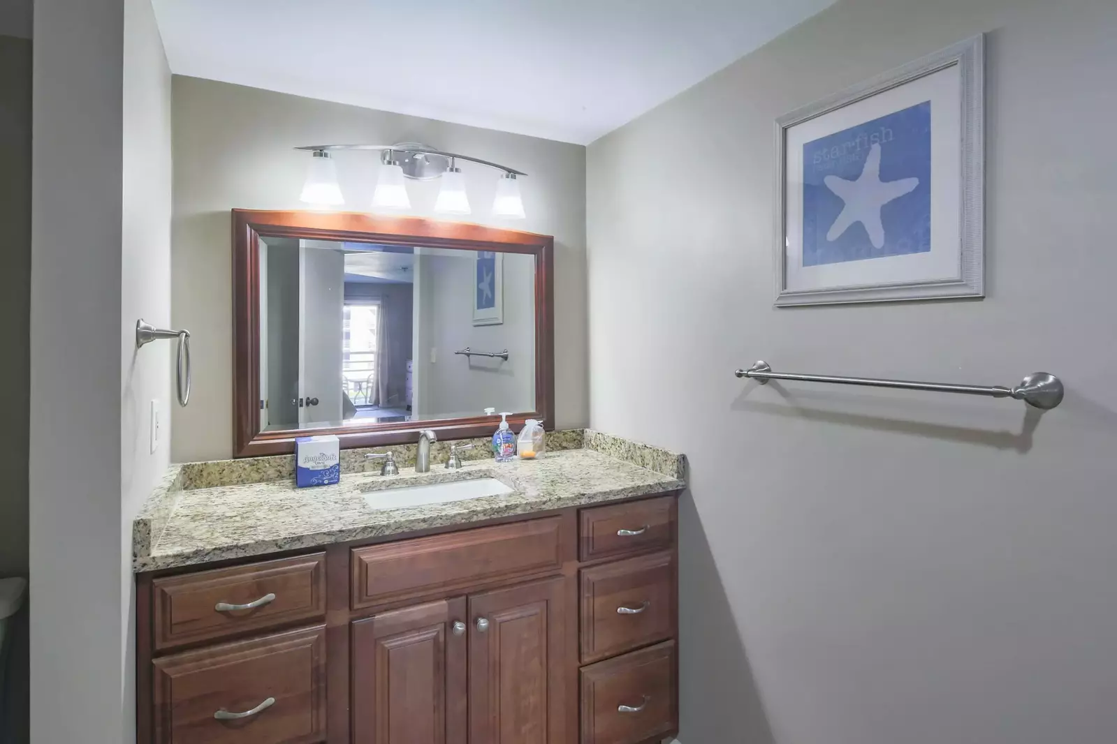 The en suite bathroom for the guest suite features a spacious vanity.