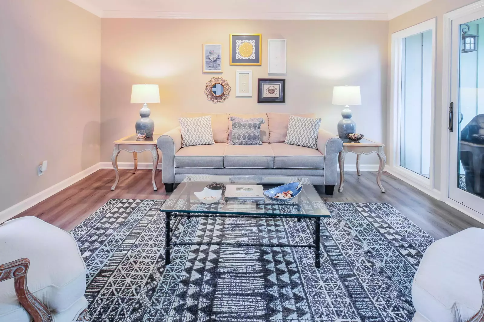 The living room connects to both the entryway & front door as well as the back patio.