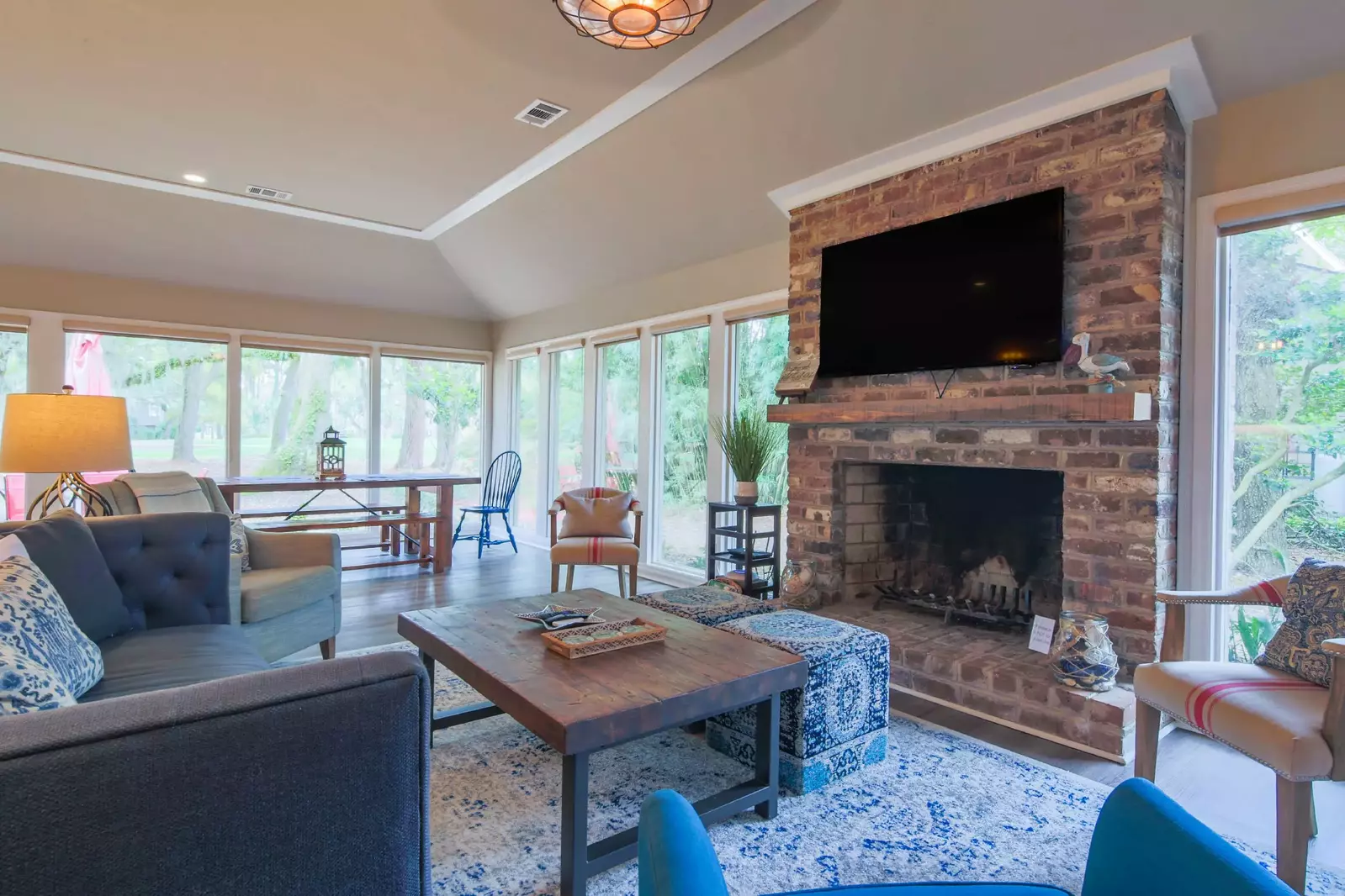 The family room features a spacious seating area and wall-mounted TV.  (Fireplace is not available for guest use.)