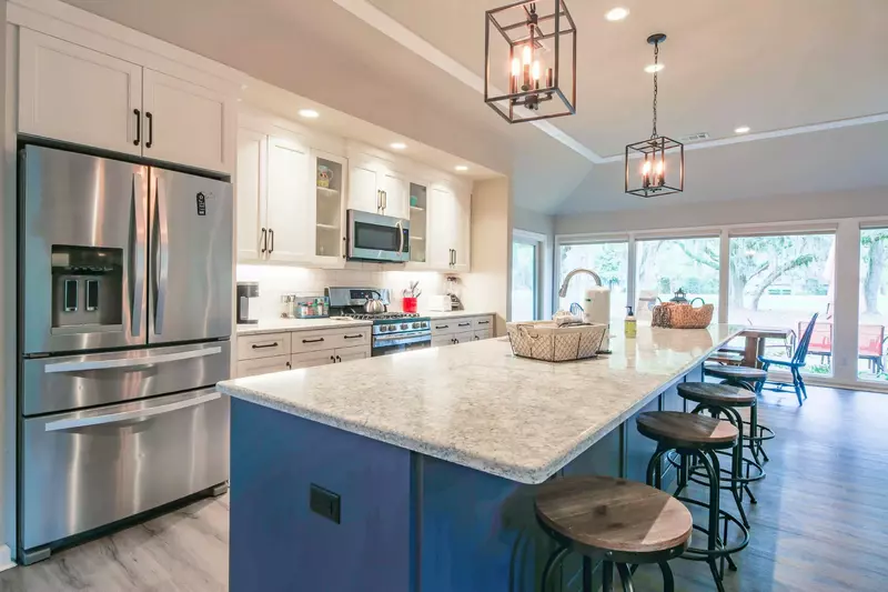 There is plenty of room to prepare your vacation feasts in this large kitchen with a central island.